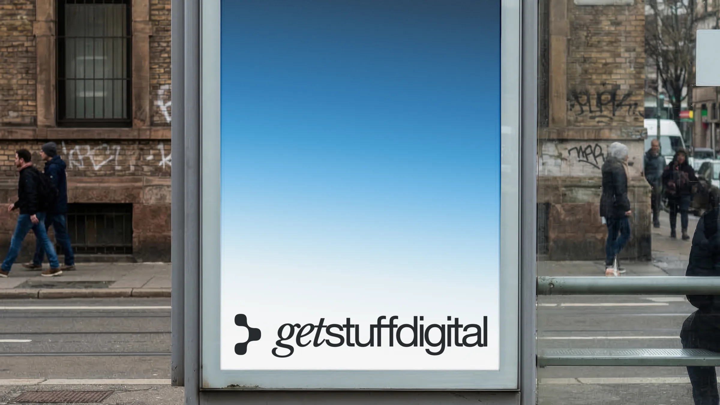 Mockup: a bus shelter poster with the Get Stuff Digital logo on the brand's blue gradient